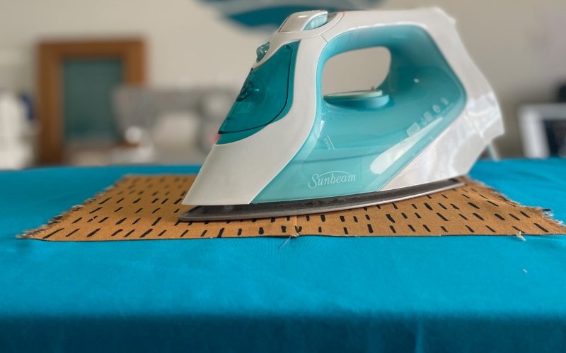 A flat ironing surface is paramount for achieving wrinkle-free results and preventing damage to your clothes