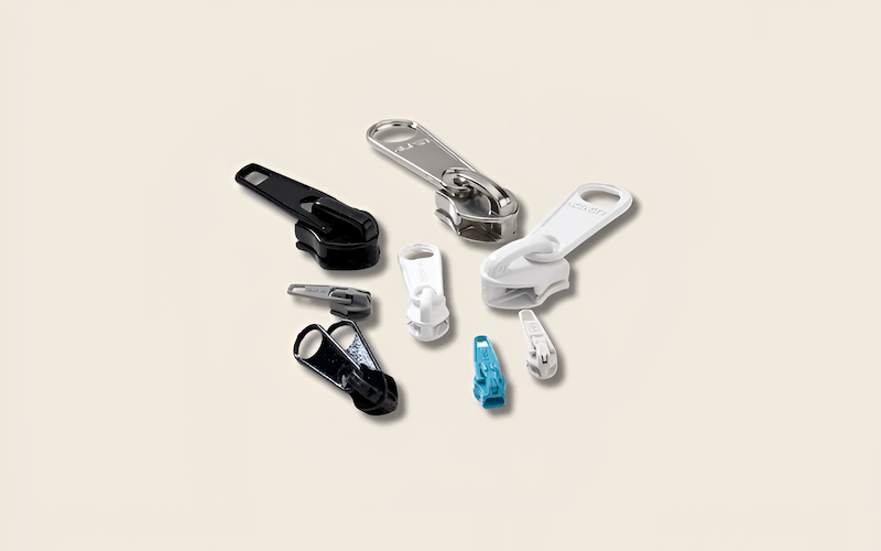 Plastic sliders are typically used with plastic or coil zippers, and nylon sliders are often found on coil zippers as well