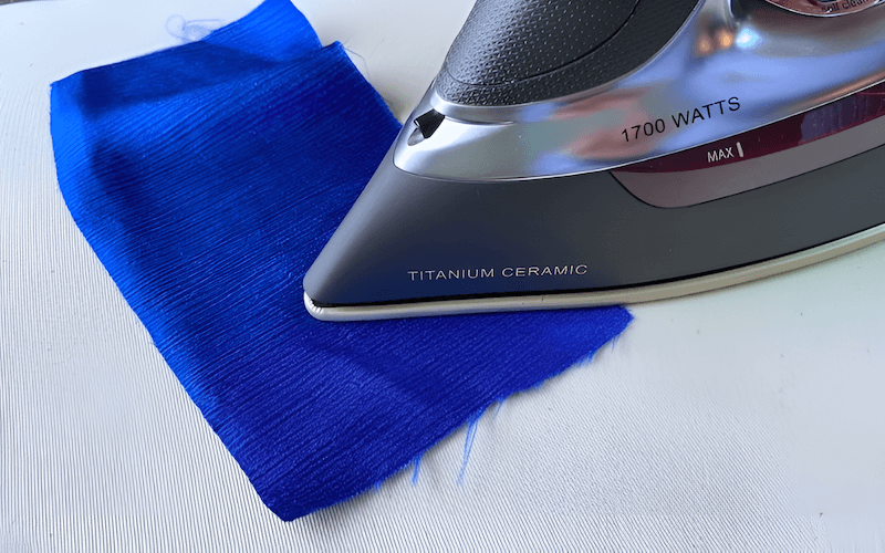 Before ironing an entire garment, always test the iron’s heat on a small, hidden area, such as an inside seam or hem