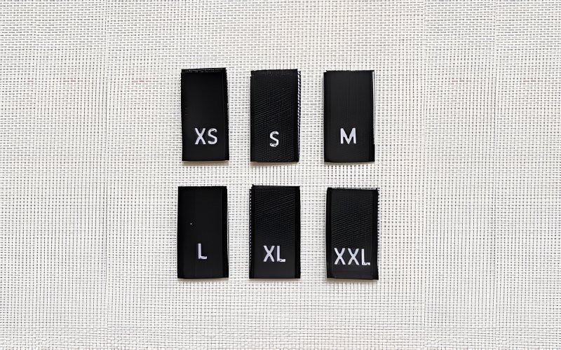 Woven size labels are a time-honored choice, offering a sophisticated and durable option