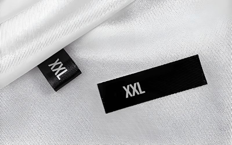 The type of clothing being labeled is a primary factor in choosing the appropriate material
