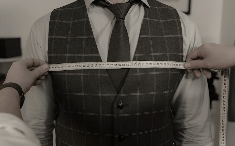 Points of Measurement (POMs) are precisely defined locations on a garment where specific garment dimensions are taken