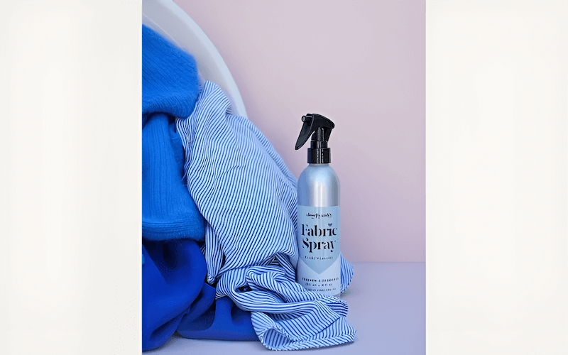 A fabric freshener spray can help neutralize odors and keep clothes smelling fresh between washes.