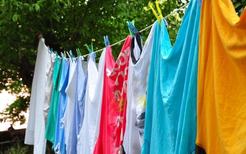 Air drying or low heat helps preserve brightness and extend garment life