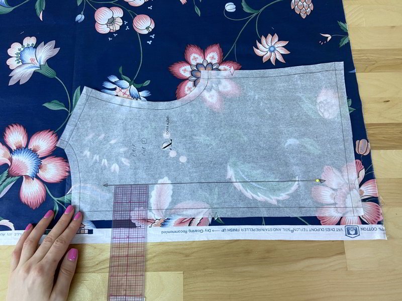 Align pattern grainline arrows parallel to selvage accurately.