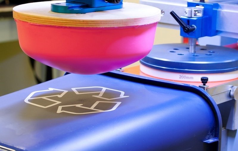 Flexible pad prints precisely on curved apparel surfaces.