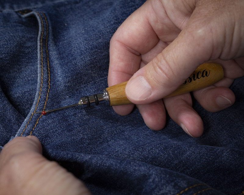 Close-up of essential seam ripper tool for fixing mistakes.