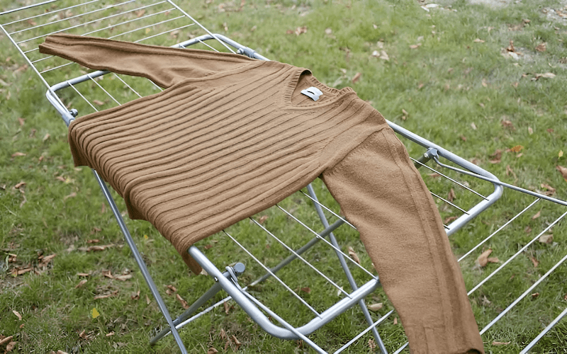Avoid hanging heavy knits when wet, and always lay them flat to dry