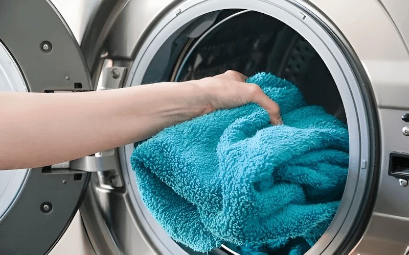 Machine drying on a medium to high heat setting is generally acceptable for towels and bedding, providing a fluffy and soft result