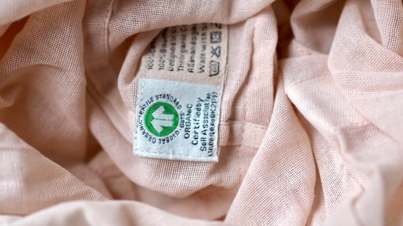 The main label serves as the primary visual identifier for your brand directly on the garment