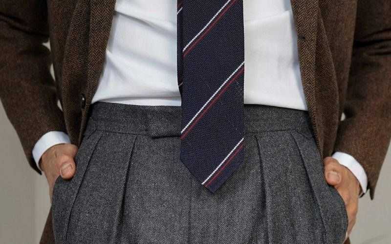 Pleats in trousers are typically found at the front, just below the waistband