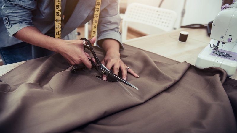 While often associated purely with decoration or surface embellishment, trimming in the context of clothing manufacturing encompasses much more
