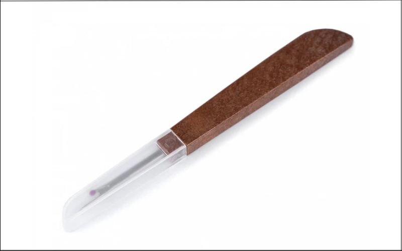 Most seam rippers come with a plastic protective cap. It fits over the forked head