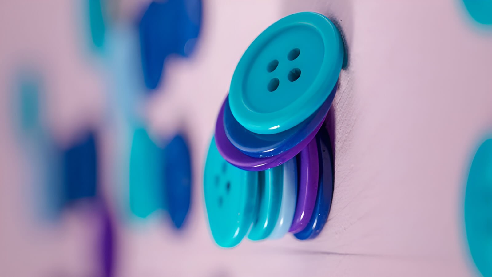A button is a small piece, often round, that we use on our clothing