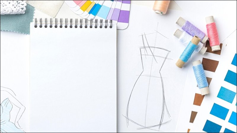 The hands-on process of draping fabric directly onto a dress form