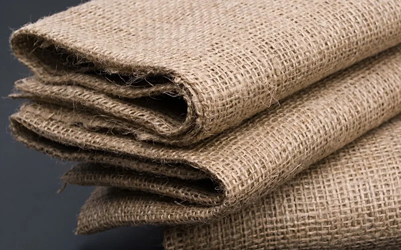 Feel the distinct, coarse character of jute fabric.