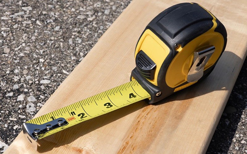 The lines and numbers on a measuring tape show you the length or size