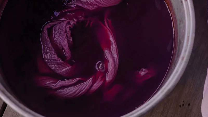 Inside the dye bath: Fabric gets its vibrant hue.