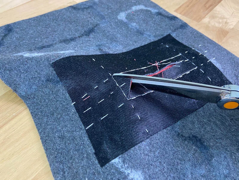 Crafting a welt pocket: Precision sewing in progress.