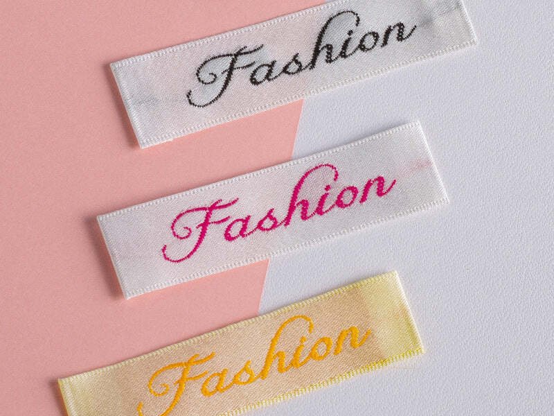 Soft satin & tagless: Packlove label options for comfort.