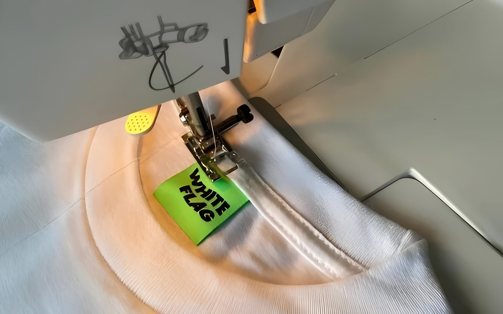 Using a sewing machine significantly speeds up the process of attaching labels