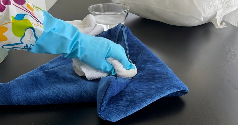 Testing a cleaning solution on a hidden seam of a garment.