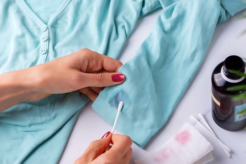 Acetone can dissolve stubborn glue, but use it with great care.