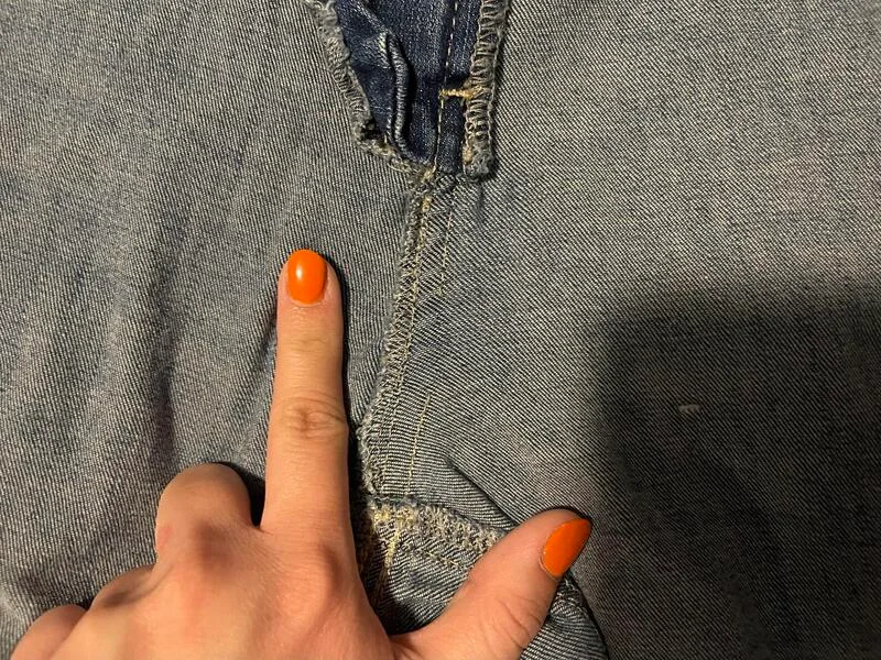 Patience and a strong backstitch are key to a durable fix.