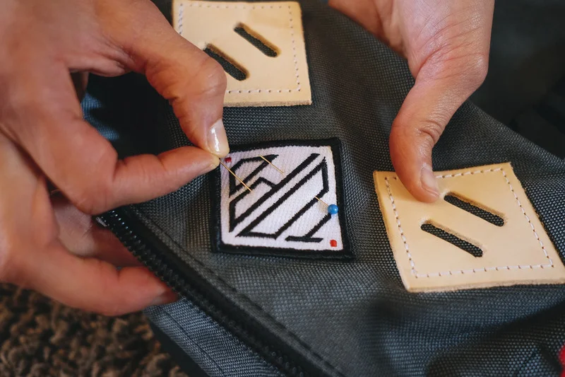 Explore sew-on options like our woven labels for a guaranteed hold.